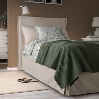INDIRA cotton bedspread on single bed, textured, warm, calming.