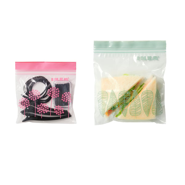 Two transparent IKEA storage bags: left bag holds small black items, right bag seals food.