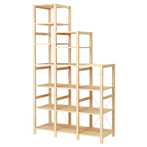 An IVAR wooden shelving unit in natural colour, made of solid pine, with modular design.