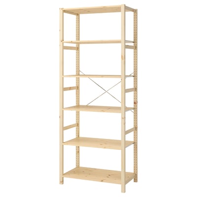 An IVAR storage unit, a tall, sturdy bookshelf made of light-colored wood, featuring five adjustable shelves and a metal cross-brace for stability.