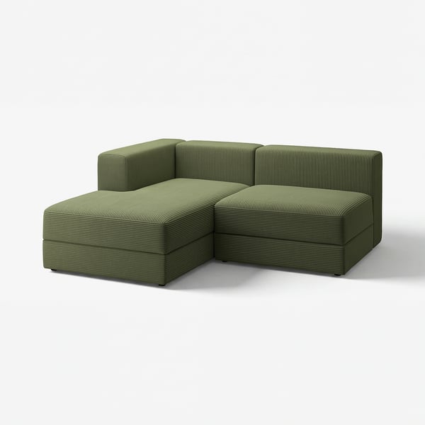 The green JÄTTEBO modular sofa with a chaise section, showcasing a sleek, modern design with a soft, corduroy texture.