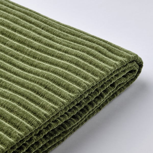 Green corduroy fabric folded detail. Textured, durable, and soft to touch. JÄTTEBO sofa cover.