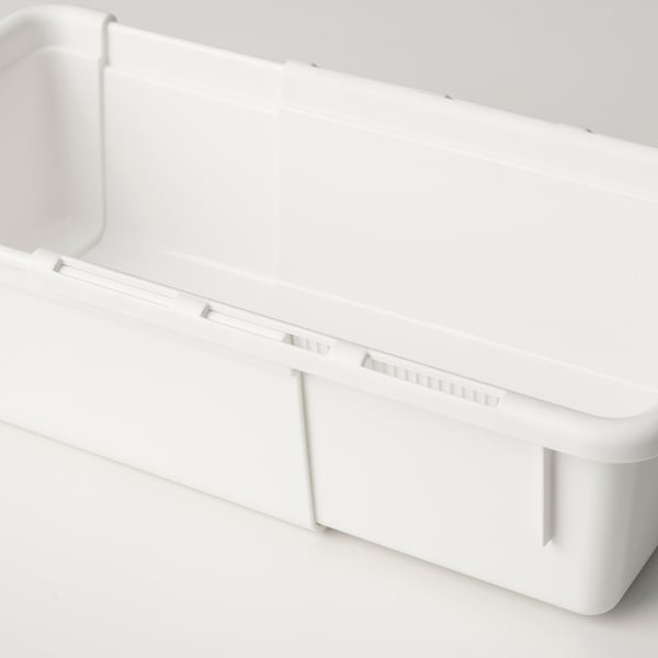 Clean, minimalist, white plastic storage box with extendable design, shown partially extended on a light surface.