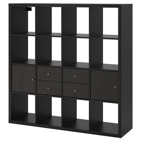 A black KALLAX shelving unit with drawers and cubes for storage. Its modern design includes empty compartments and drawers with round handles.