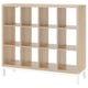 KALLAX light oak shelving with cube compartments and metal base.