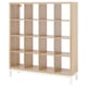 A KALLAX light brown cube shelf with white legs. It has a minimalist design with multiple square compartments for storage.