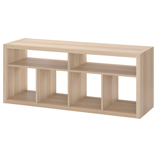 A light brown ikea KALLAX shelving unit with open compartments, perfect for storage and cable management.
