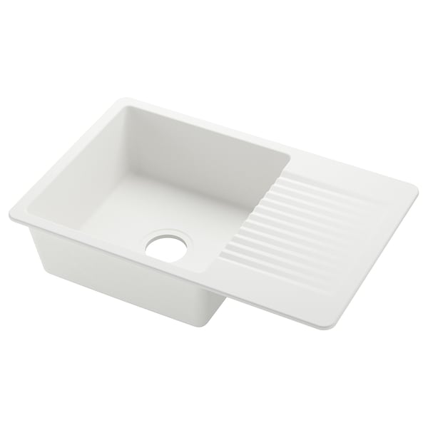 The KILSVIKEN sink is a white, rectangular, quartz composite kitchen sink with a single basin and a drainer area on the right.