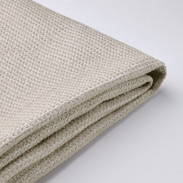 A beige woven fabric folded neatly, showcasing its textured quality and softness.