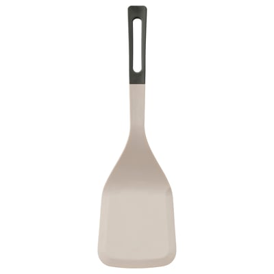 A KNORRHANE spatula in beige with a black handle, featuring a soft silicone tip and an ergonomic design for flipping and serving food.