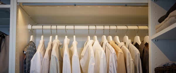 Clothes rail with shirts on hangers