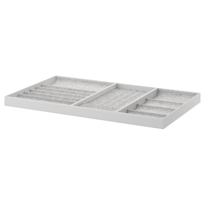 White KOMPLEMENT jewellery organiser, felt-lined compartments for necklaces, rings, and watches.