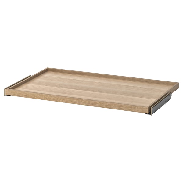 An ikea KOMPLEMENT pull-out tray in light oak color, designed for wardrobe storage, with a wooden and metal design.
