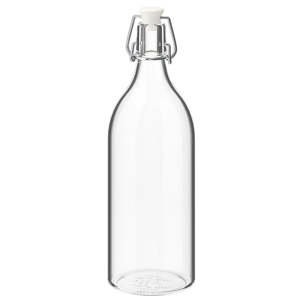 KORKEN glass bottle, clear, with metal clamp and white stopper, cylindrical shape.