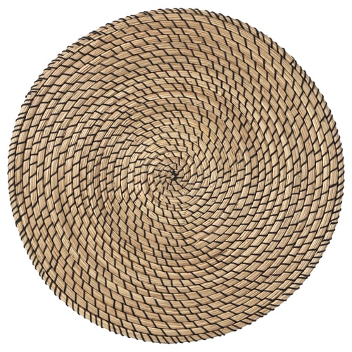 Round, woven seagrass place mat with black outlines.
