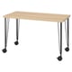 LAGKAPTEN: modern light wood desk, four black metal legs with wheels.