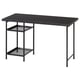 Black LAGKAPTEN desk with metal legs and mesh shelves.