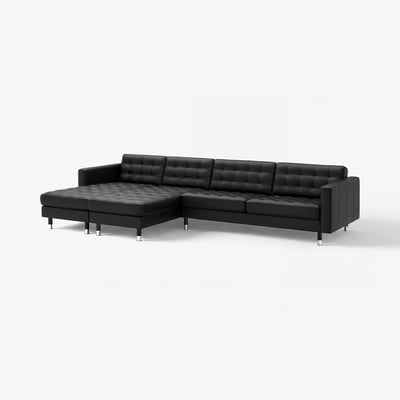 Black l-shaped leather sofa. Modern, tufted design. Sturdy chrome legs. 10-year guarantee.