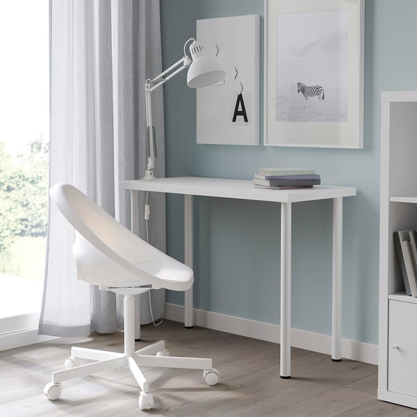 Modern home office: white LINNMON desk, chair, light blue walls, window.