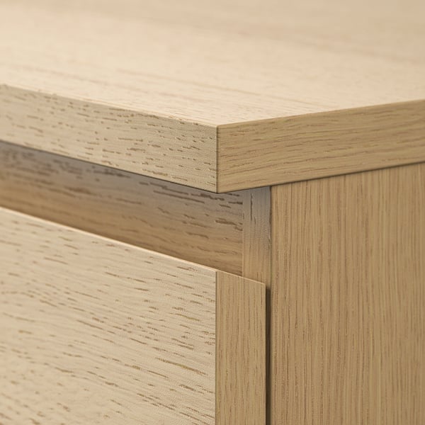 Close-up of smooth wooden drawer edges, showing detailed craftsmanship and quality.
