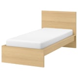A light wood-colored MALM bed with a white mattress against a white background.
