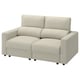 A beige MALMKÖPING sofa with adjustable headrests and convertible chaise lounges, designed for ultimate comfort and versatility in a modern setting.