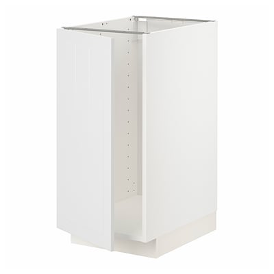 A white METOD kitchen cabinet. Its rectangular, with vertical grooves on the door, and a sturdy frame. Its designed for versatile kitchen storage.