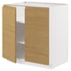 METOD kitchen unit with oak-effect doors, minimalist design, white frame.