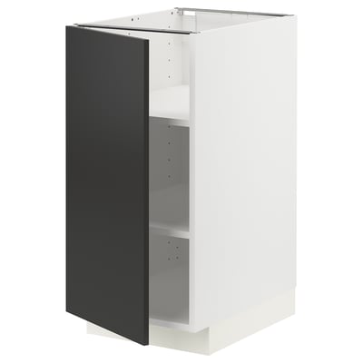 A modern, white METOD kitchen cabinet with a black matt nickebo door, adjustable shelves.