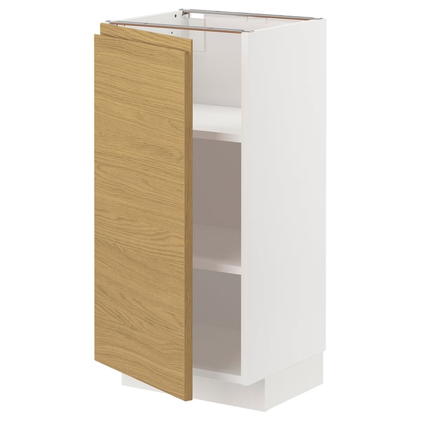 METOD kitchen cabinet, white and oak, minimalist design, with one open door.