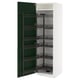 White kitchen cabinet with green door and pull-out spice racks.