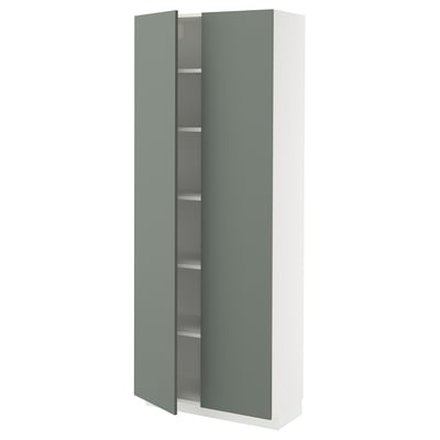A tall white cabinet with a green door, featuring multiple shelves inside.