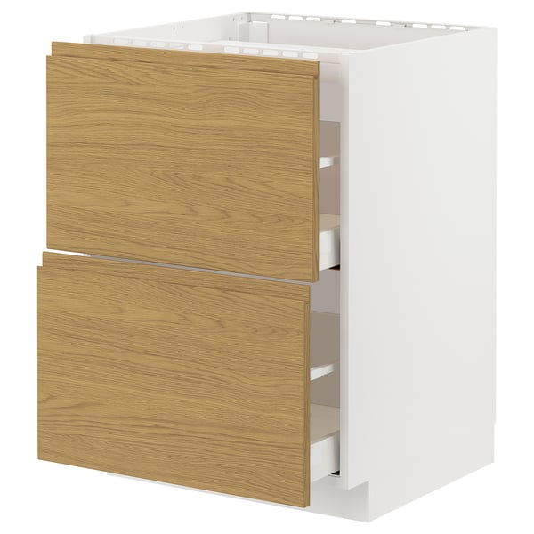 A white METOD kitchen cabinet with oak-colored drawers.