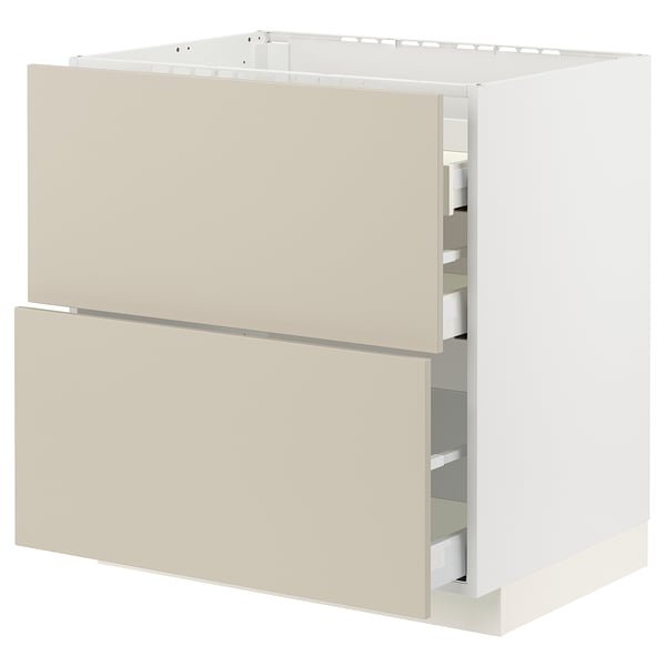 Displays a beige METOD kitchen cabinet with two full-extension drawers, featuring a sleek and modern design.