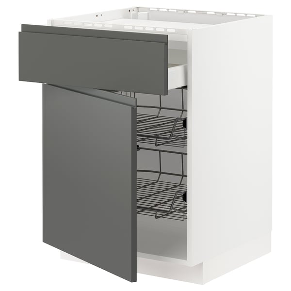 A white METOD kitchen cabinet with dark grey voxtorp drawers. It multiple shelves and smooth-gliding baskets.