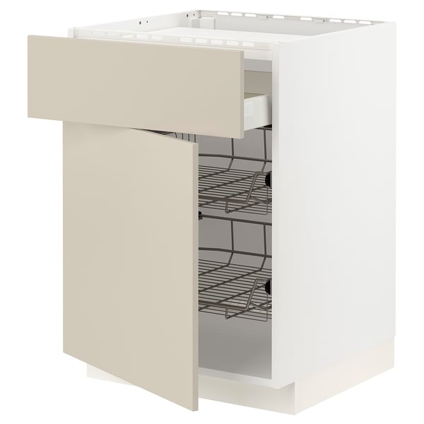 A white METOD kitchen cabinet with a beige drawer, featuring metal shelves and a modern design.