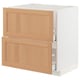 Modern white kitchen cabinet with oak drawers and door.