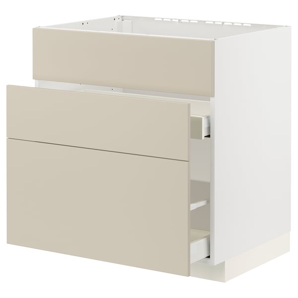 Modern beige kitchen cabinet with smooth, minimalist design and full-extension drawers.