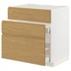 A white METOD kitchen cabinet with oak effect drawers and minimalist handles, combining warmth and modern design.