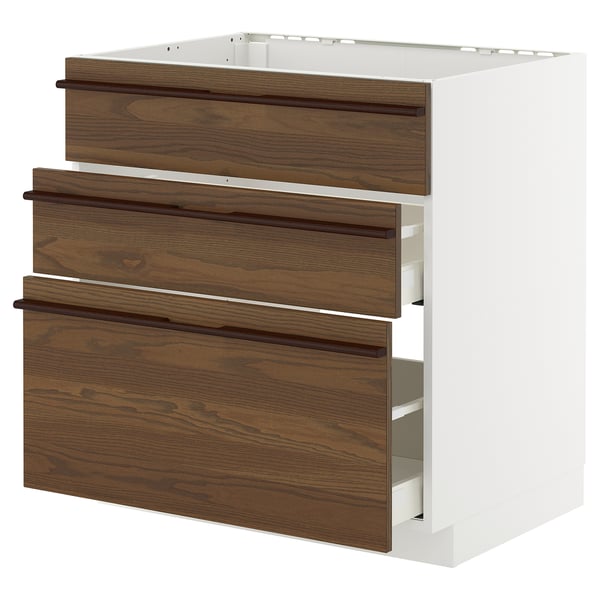 White and brown kitchen unit with three wooden drawers, featuring solid wood handles and full-extension drawers.