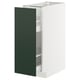 The METOD kitchen cabinet with havstorp green doors. Its a tall, rectangular white cabinet with pull-out shelves inside.