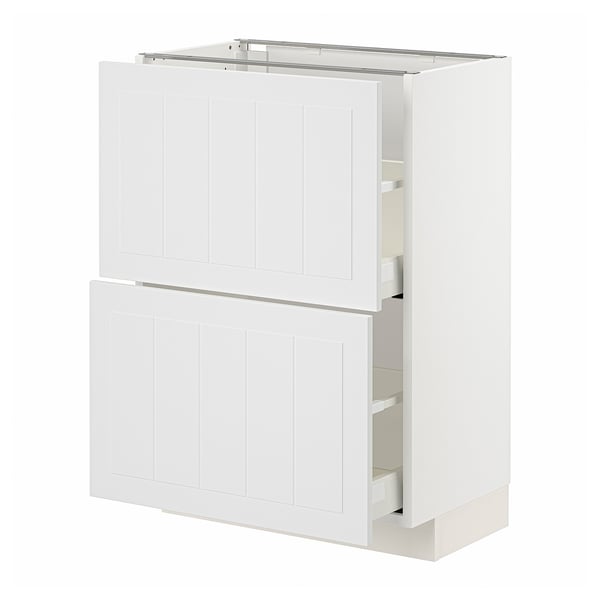 A white METOD kitchen cabinet with two doors and two drawers. It has a clean, modern design with vertical grooves on the doors.