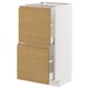 METOD kitchen unit with oak effect drawers and white frame.