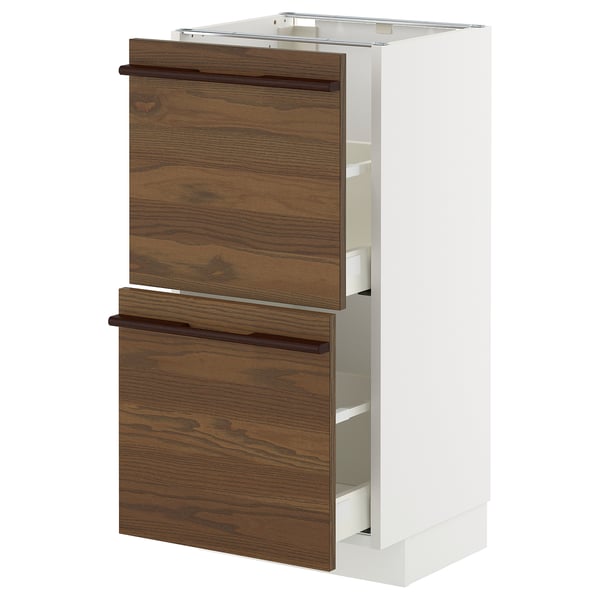 METOD kitchen unit with dark brown drawers, white cabinet, wooden handles.