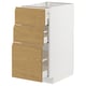 White METOD kitchen cabinet with three wooden drawers in a warm oak finish. Vertical, rectangular, and modern.