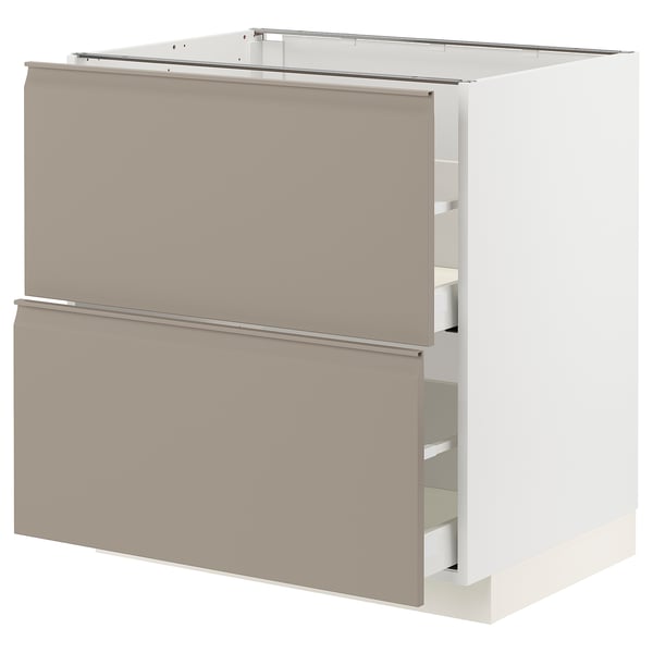 An off-white METOD kitchen cabinet with two grey-beige drawers and a modern design. It has integrated handles and smooth, full-extension drawers.