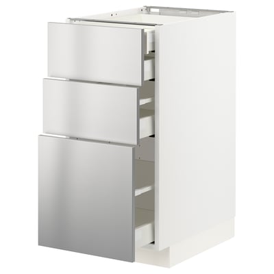 Modern kitchen cabinet with three stainless steel drawers, sleek design, part of METOD system.