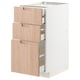 Modern white kitchen unit, light bamboo drawers, minimalist design.