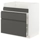 A white METOD kitchen cabinet with dark grey voxtorp drawer fronts. It three drawers and a base for built-in appliances or a sink.
