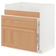 An ikea METOD kitchen cabinet with oak drawer fronts. It has a white base and three wooden drawers.